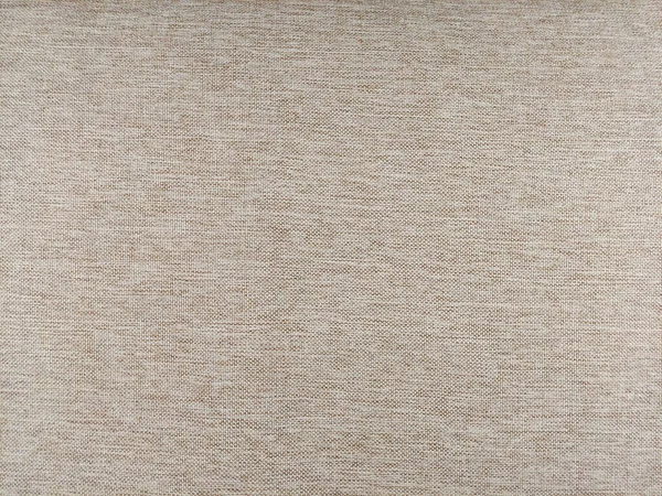 Fabric matting beige texture. Textured background made of wool or synthetic fibers, polypropylene, nylon or polyester