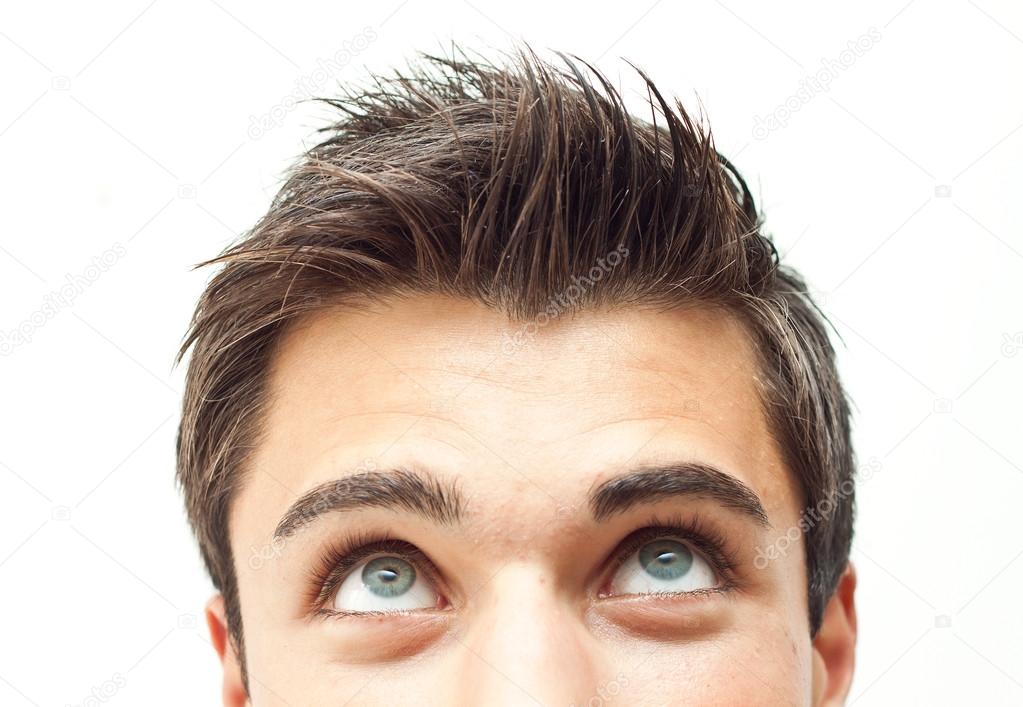 Young attractive man face looking up