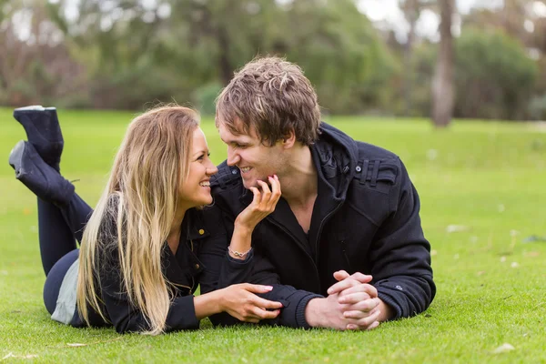 Happy young attractive couple portrait, smiling in outdoor environment — Stock Photo, Image