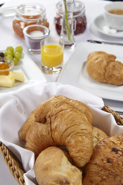 Breakfast table - croissant and bread roll — Stock Photo, Image