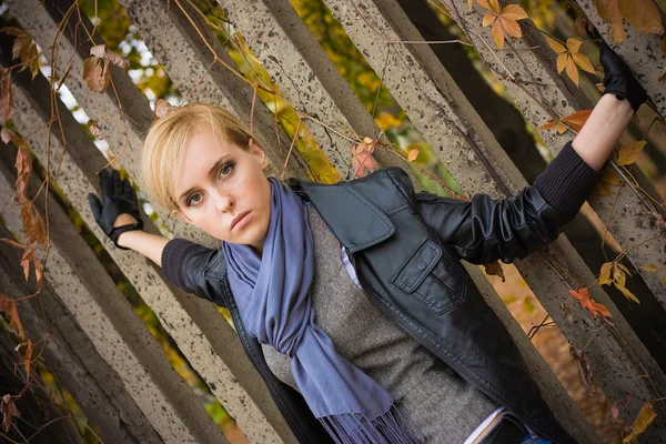 Young pretty girl near stone fence — Stock Photo, Image