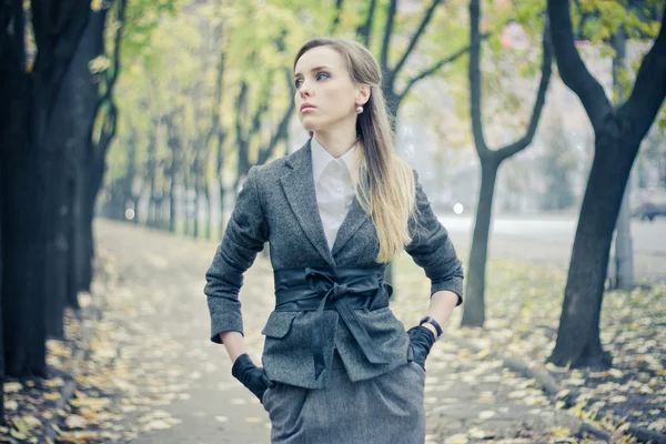 Beautiful girl at the autumn alley — Stock Photo, Image