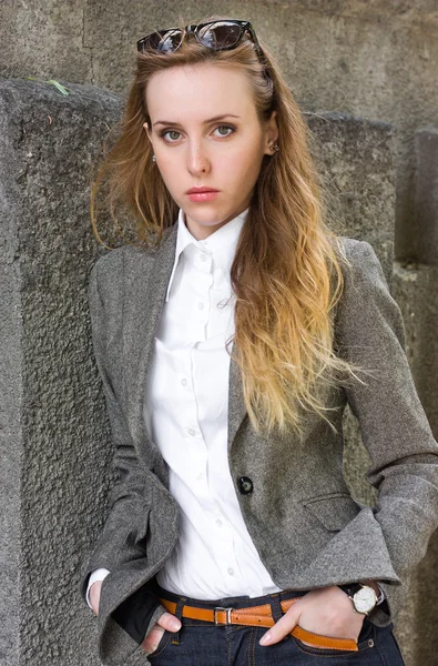 Triptych of portraits young woman near the wall — Stock Photo, Image