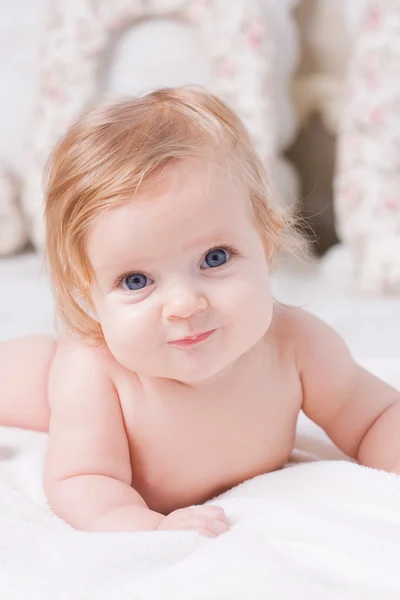 Cute little baby in bedroom Stock Image