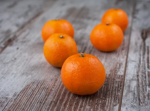 Mandarins on a wood with blur — Stock Photo, Image