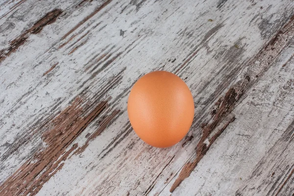 Egg on the wooden floor — Stock Photo, Image