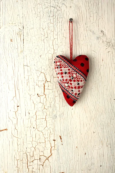 Heart symbol hand made on a old wooden door — Stock Photo, Image