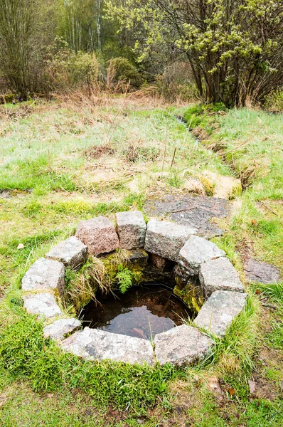 Shallow sacrificial well — Stock Photo, Image