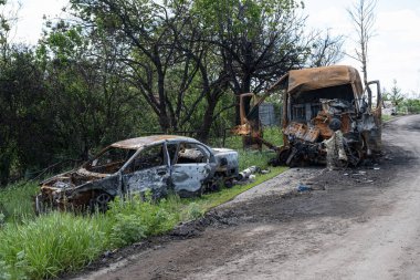 Burned and broken cars. War in Ukraine 2022. Russian missiles in Kharkiv Ukraine. Russian aggression, conflict. Russian attack on Ukraine. Russia is bombing Ukraine