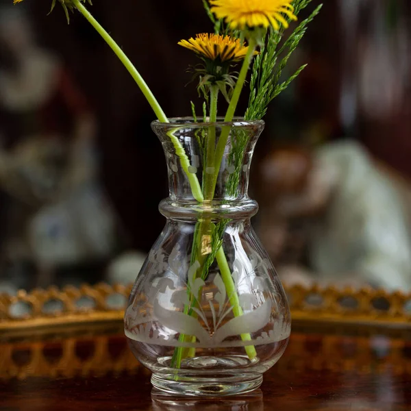 antique transparent glass vase in luxury interior. crystal vase with engraving. glass close-up