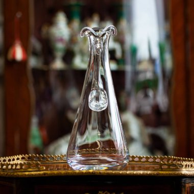 glass antique decanter in luxury interior. crystal clear wine decanter. bohemian glass closeup