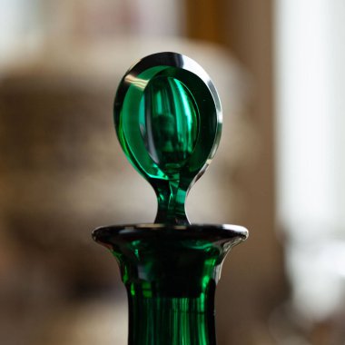 green antique glass close-up in a luxury interior. bohemian glass closeup