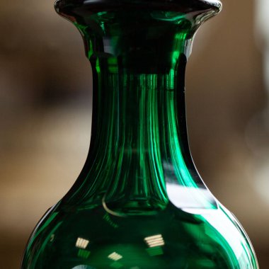 green antique glass close-up in a luxury interior. bohemian glass closeup
