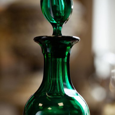 green antique glass close-up in a luxury interior. bohemian glass closeup