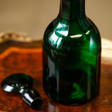 green antique glass close-up in a luxury interior. bohemian glass closeup