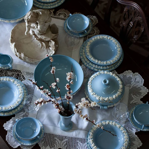 Antique British blue porcelain tea set.wedding table setting is richly decorated in luxurious interior. porcelain vintage service