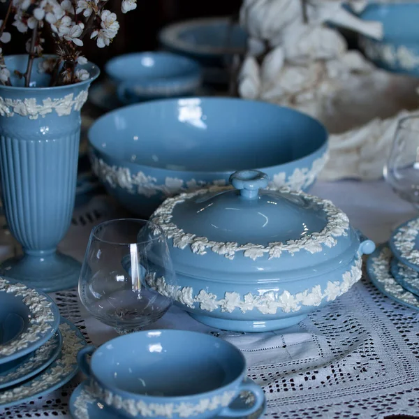 Antique British blue porcelain tea set.wedding table setting is richly decorated in luxurious interior. porcelain vintage service