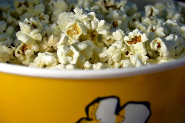 Popcorn with red background — Stock Photo, Image