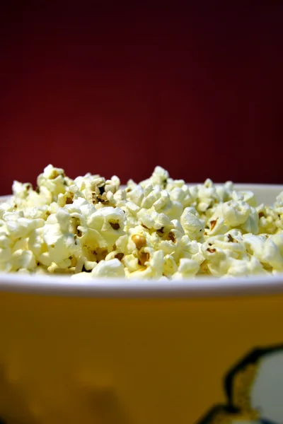 Popcorn with red background — Stock Photo, Image