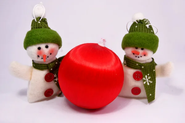 Snowman with red christmas ball — Stock Photo, Image