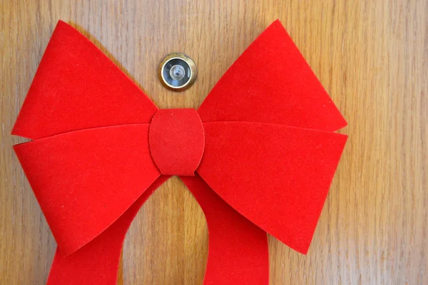 Red bow on the door — Stock Photo, Image