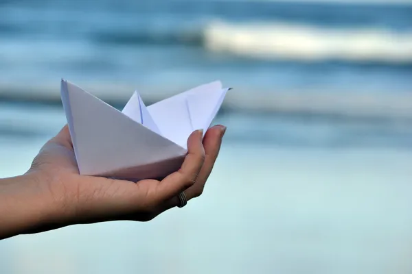Paper boat on beach — Stock Photo, Image