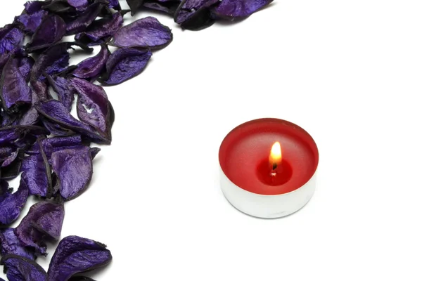 Purple petal and candle — Stock Photo, Image