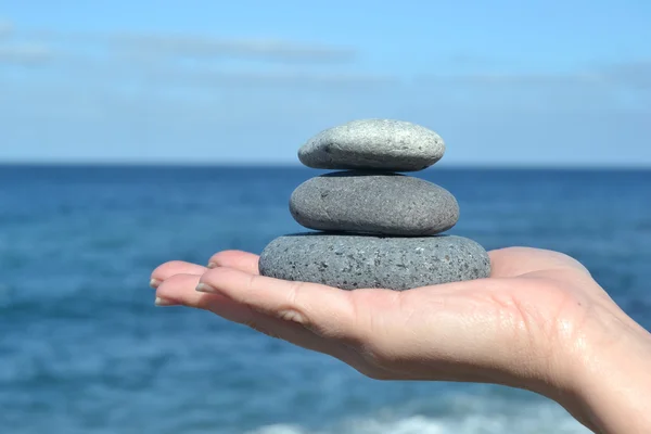 Zen stones in hand — Stock Photo, Image