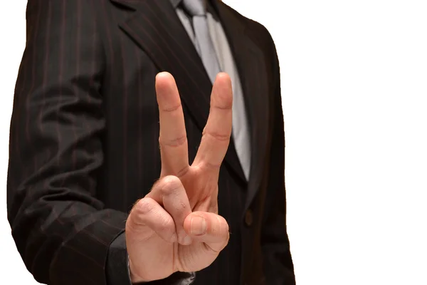 Businessman showing fingers in victory — Stock Photo, Image