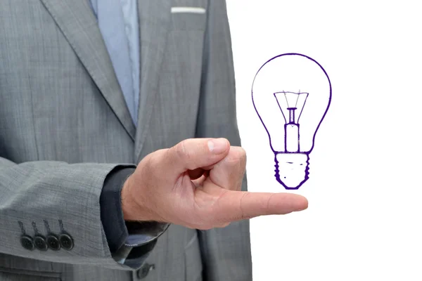 Empresário com uma lâmpada desenhada — Fotografia de Stock