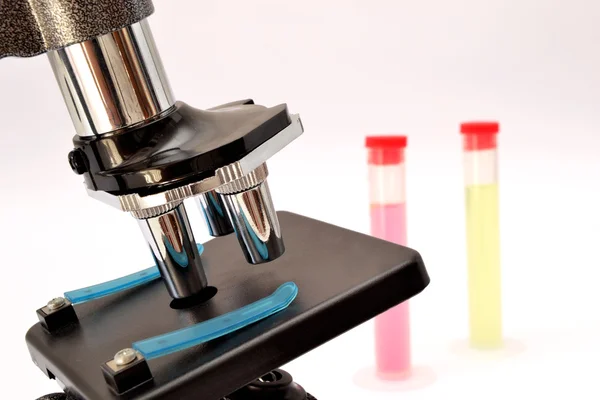 Microscope and test tubes — Stock Photo, Image