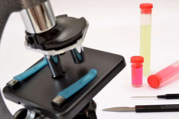 Microscope and test tubes — Stock Photo, Image