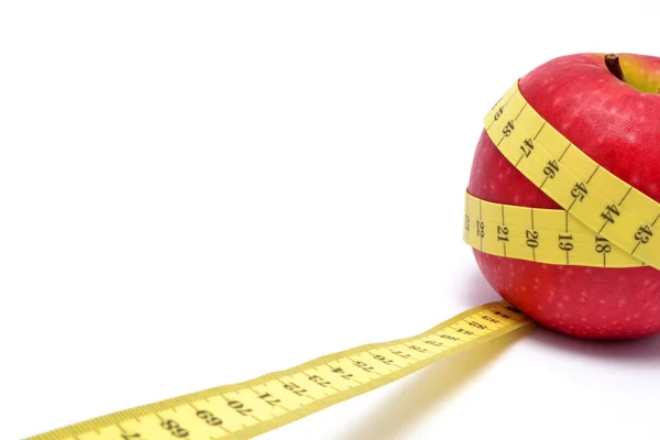 Apple and tape measure — Stock Photo, Image