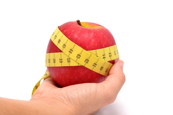 Apple and tape measure Stock Picture