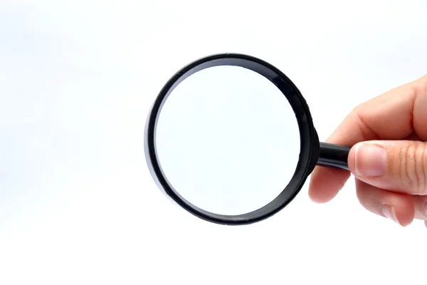 Hand with a magnifying glass — Stock Photo, Image