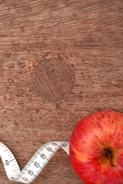 Apple and tape measure — Stock Photo, Image