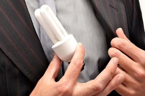 Man and light bulb in hand — Stock Photo, Image