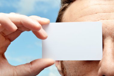 Man with a white card in hand clipart