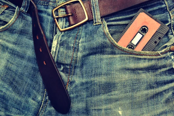 Jeans e fita cassete fundo — Fotografia de Stock