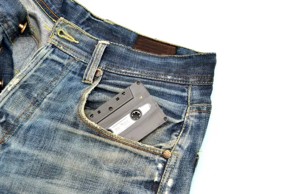 Jeans e fita cassete fundo — Fotografia de Stock