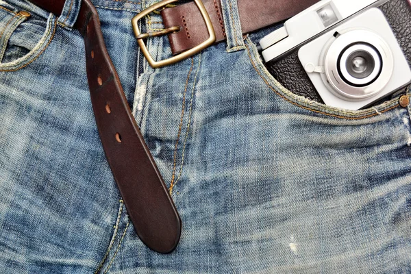 Jeans and old camera — Stock Photo, Image