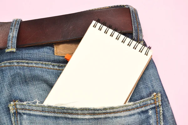 Caderno e jeans — Fotografia de Stock