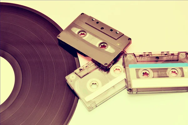 Tape cassette and vinyl record — Stock Photo, Image