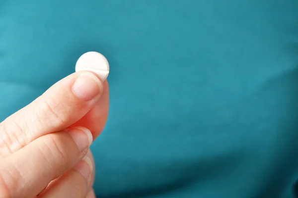 Person showing a pill — Stock Photo, Image