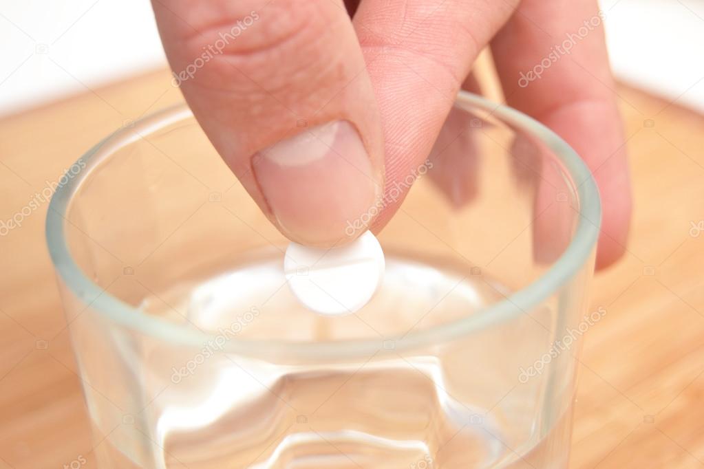 Person pill in a glass