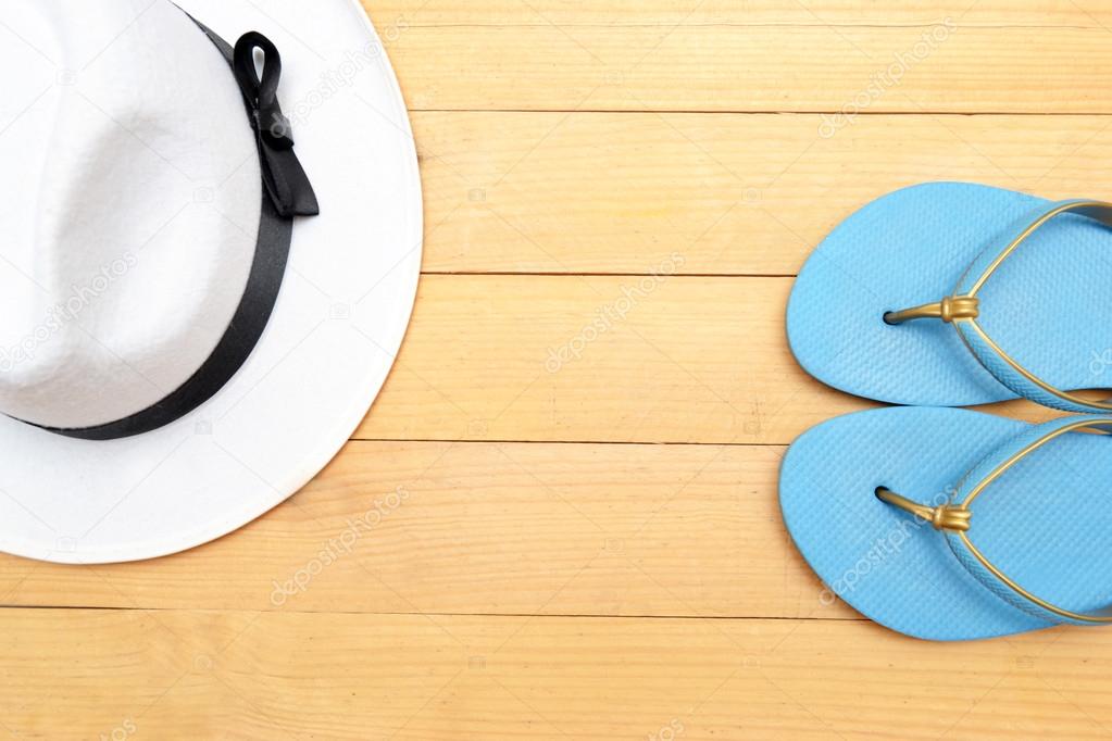 White hat and beach slippers