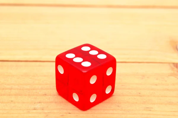 Red dice on wood — Stock Photo, Image