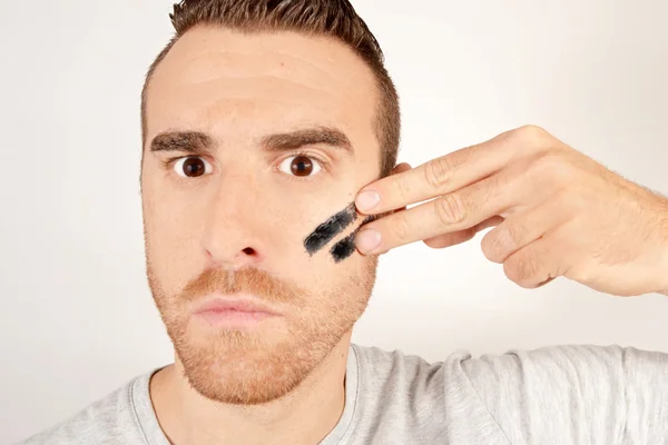 Man with painted face of war — Stock Photo, Image