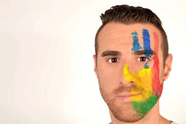 Joven con la cara pintada — Foto de Stock