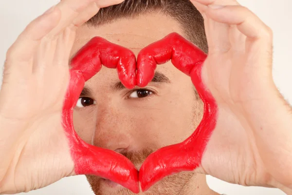 Man with heart shaped hands — Stock Photo, Image